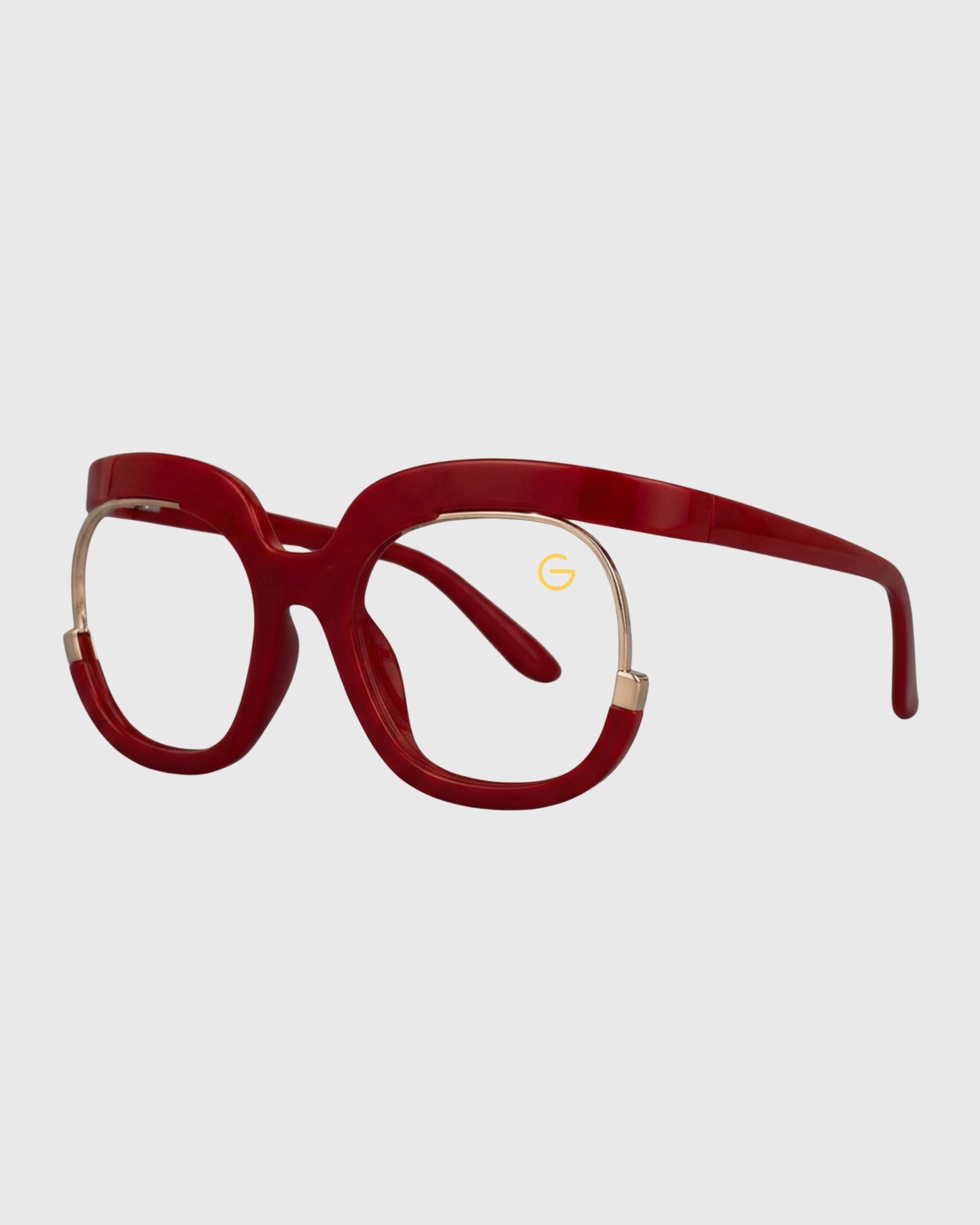 A pair of stylish glasses featuring a red frame with elegant gold detailing.