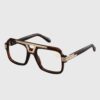 A pair of glasses featuring a gold frame and brown temples, elegantly designed for stylish eyewear.
