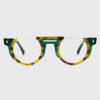 A pair of glasses featuring vibrant green and yellow frames, showcasing a modern and stylish design.