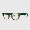 A pair of glasses featuring vibrant green and yellow frames, showcasing a modern and stylish design.