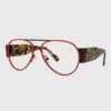 Leopard print glasses with bold red lenses, showcasing a stylish and trendy design.