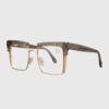 Metal glasses with clear lenses, showcasing a sleek and modern design suitable for various occasions.
