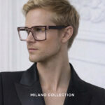 A man wearing glasses, showcasing the Milano Collection branding prominently displayed.