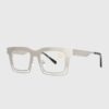 A pair of silver-framed glasses with clear lenses displayed on a neutral background.