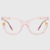 Pink cat eye glasses with elegant gold detailing, showcasing a stylish and modern design.