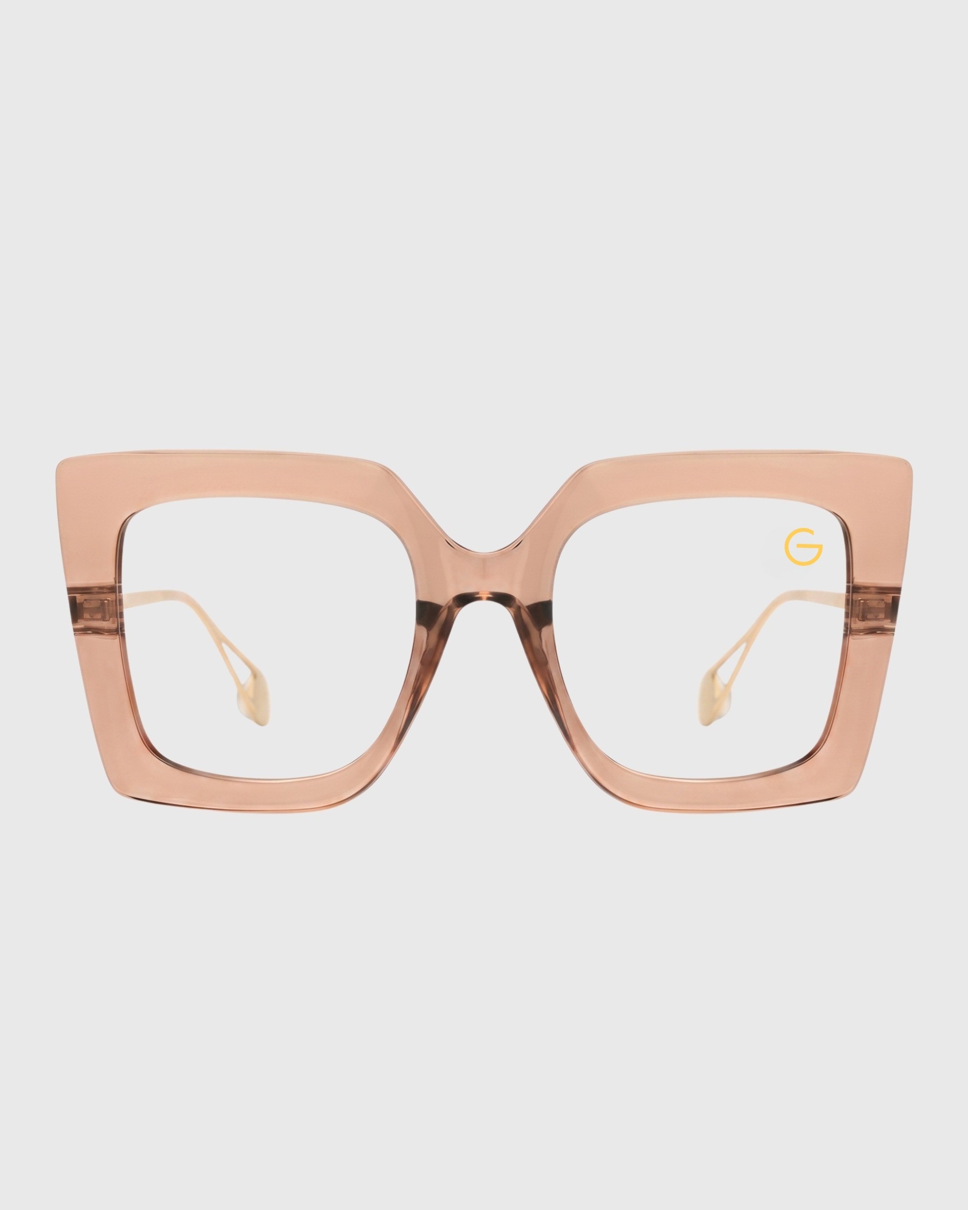 A pair of gold-framed glasses with clear lenses displayed on a neutral background.
