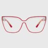 A pair of red glasses featuring clear lenses, showcasing a stylish and modern design.