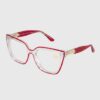 A pair of eyeglasses featuring red and clear frames, showcasing a modern and stylish design.