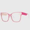 A pair of stylish glasses featuring pink frames and clear lenses, resting on a neutral background.