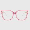 A pair of stylish glasses featuring pink frames and clear lenses, resting on a neutral surface.