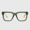 A pair of stylish glasses featuring pink frames with elegant gold detailing.