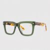 Tortoise shell glasses with a green frame, showcasing a stylish and unique design.