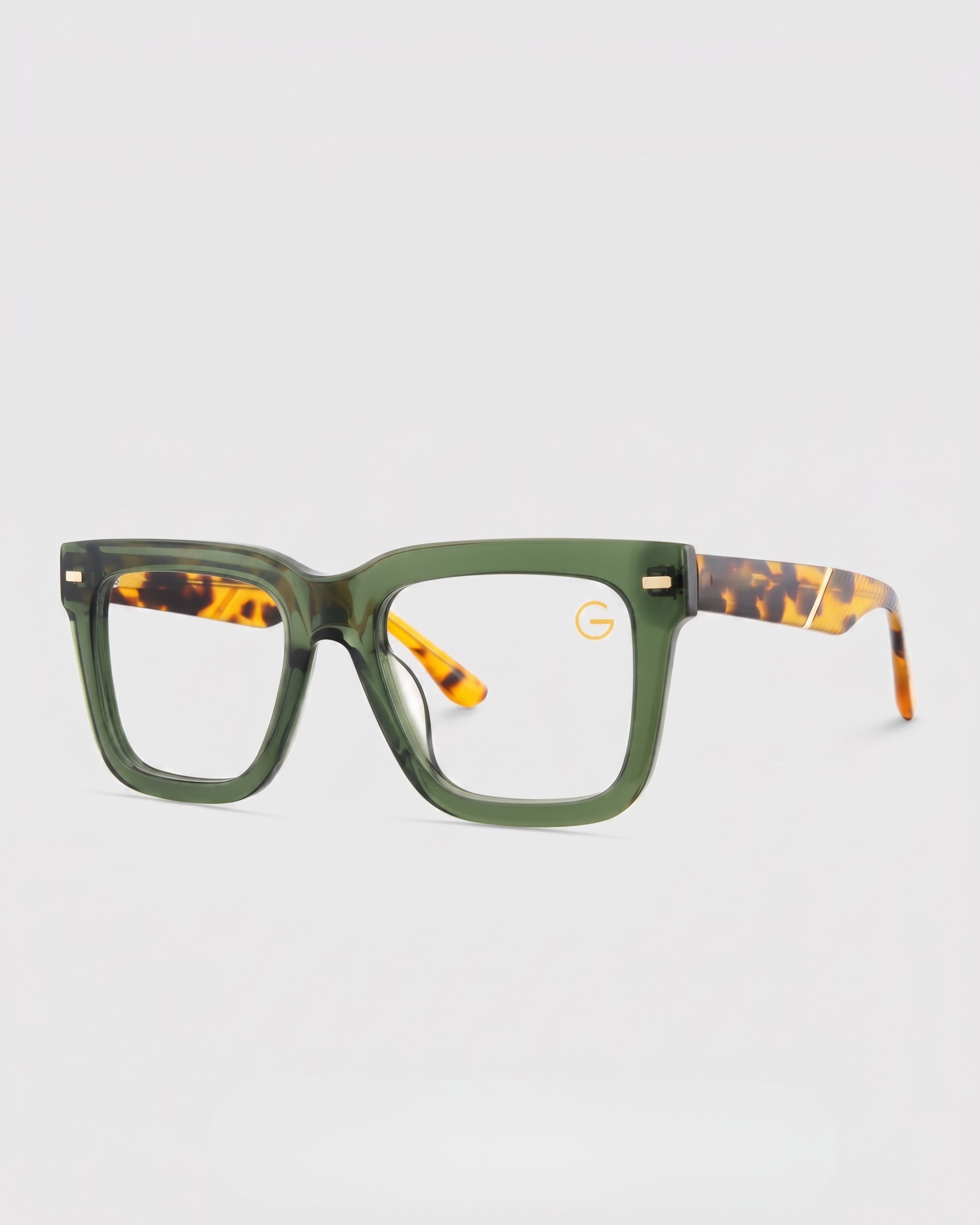 Tortoise shell glasses with a green frame, showcasing a stylish and unique design.