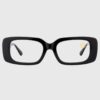 A pair of black and gold glasses featuring a stylish gold chain attached.