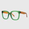 A pair of glasses featuring vibrant green and orange frames, showcasing a modern and stylish design.