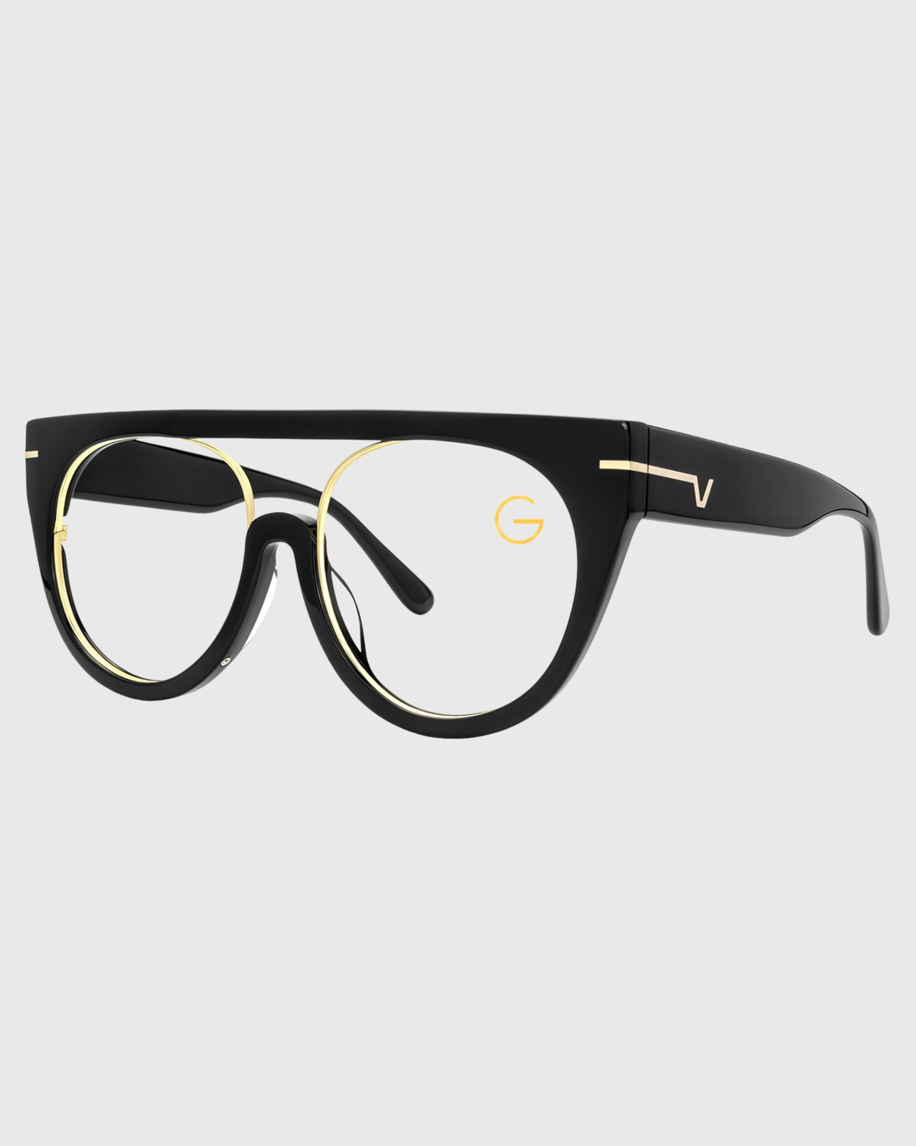 A pair of eyeglasses featuring gold rims and black frames, displayed against a neutral background.